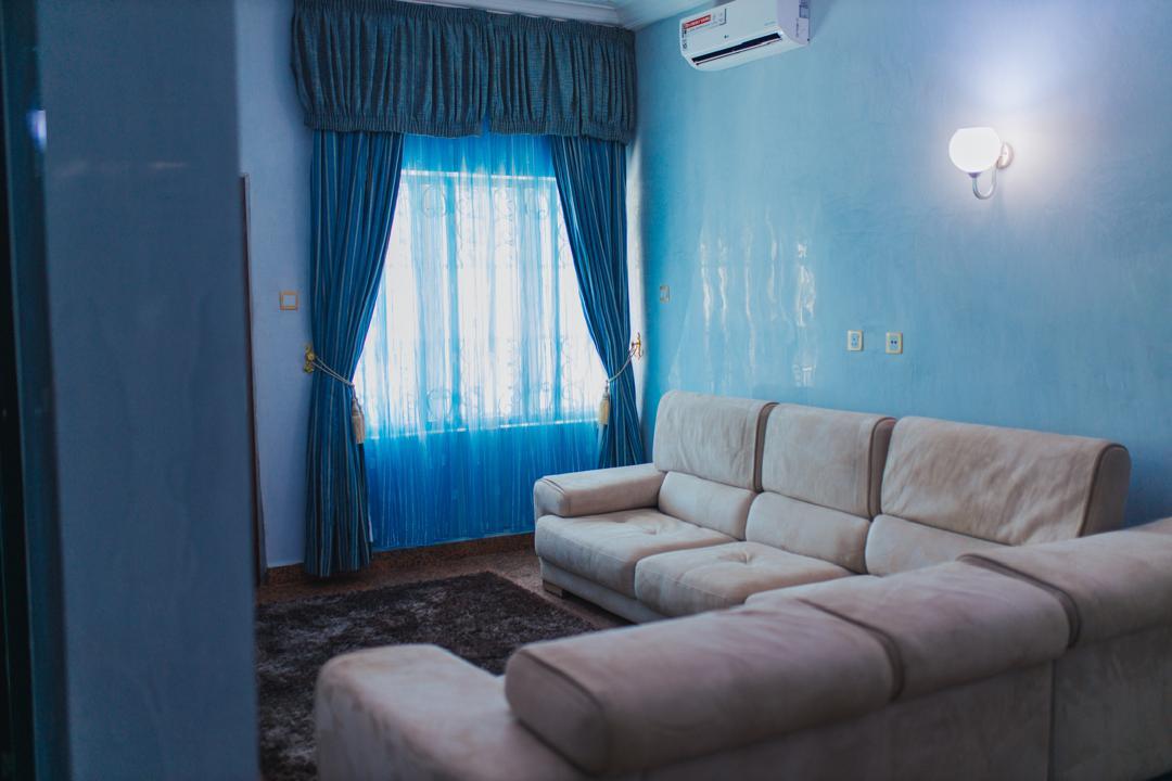 Blue family lounge with a cream sectional sofa